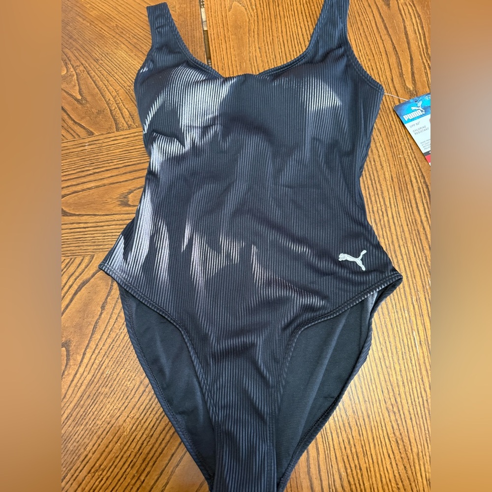 Puma Black Ribbed One Piece Swim Suit. NWT. Size Medium.